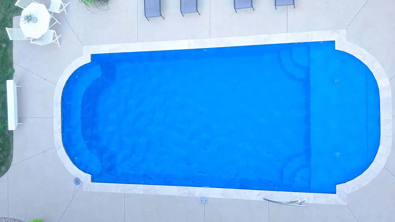 Aerial View Of Pool With Tanning Ledge