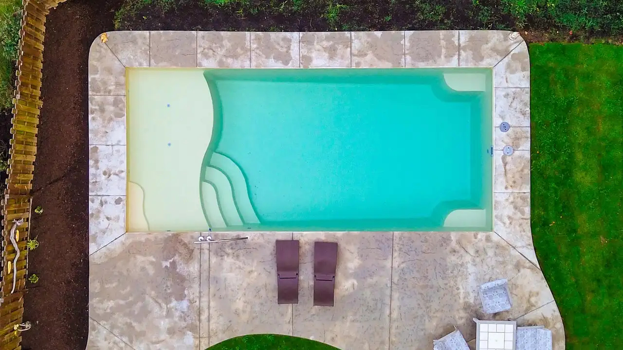 Aerial View Of Pool With Tanning Ledge