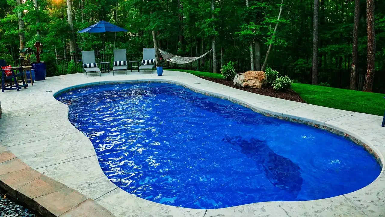 Freeform Fiberglass Pool With Stamped Concrete