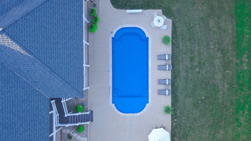 Aerial View Of Fiberglass Pool With Tanning Ledge